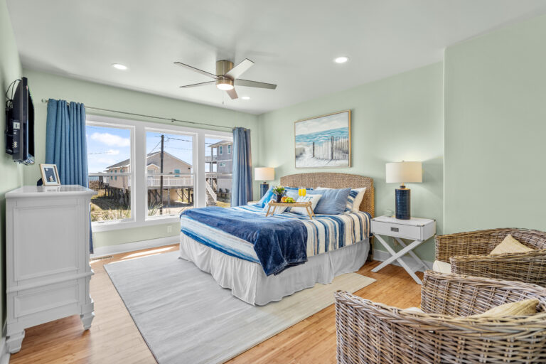 Experience the richness of color and detail with HDR photography. This bedroom reveals the stunning depth and texture of seafoam walls, showcasing every light and shadow.